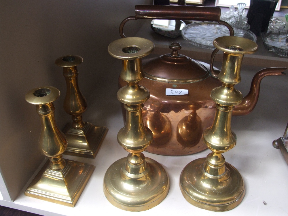 A pair of 19th century brass candlesticks, a vintage copper kettle and similar