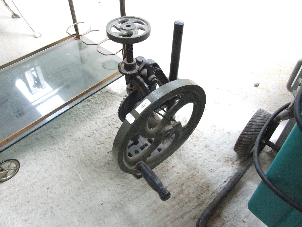 A vintage cast iron drill press