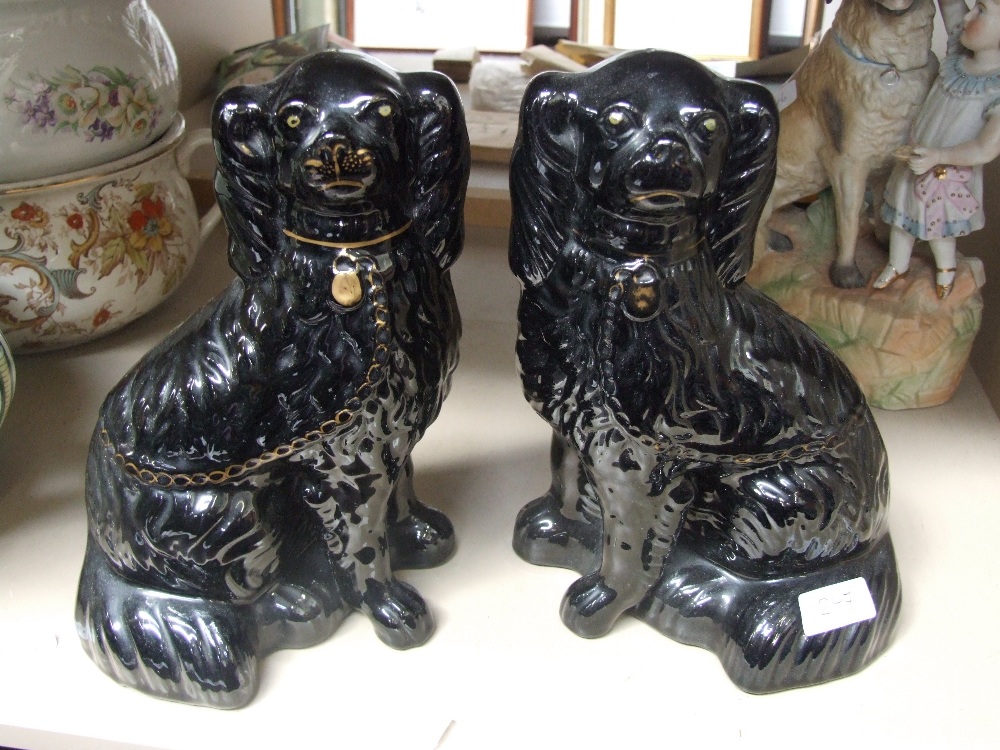 A pair of Staffordshire style dogs in Jackfield taste