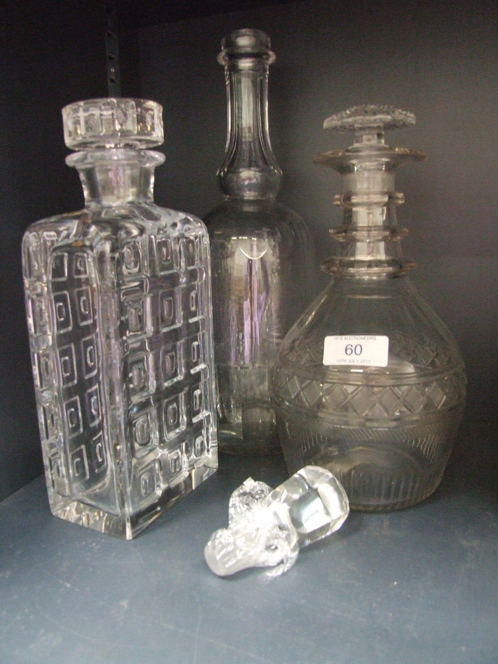 A Norwegian glass decanter numbered 161, a cut glass decanter and a cut glass decanter with