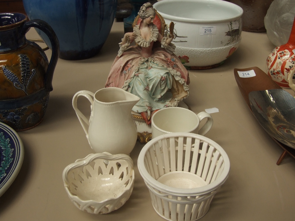 A Capo de Monte figure inscribed Cappe, a Leeds pottery sparrow beak jug, 2 similar baskets and a