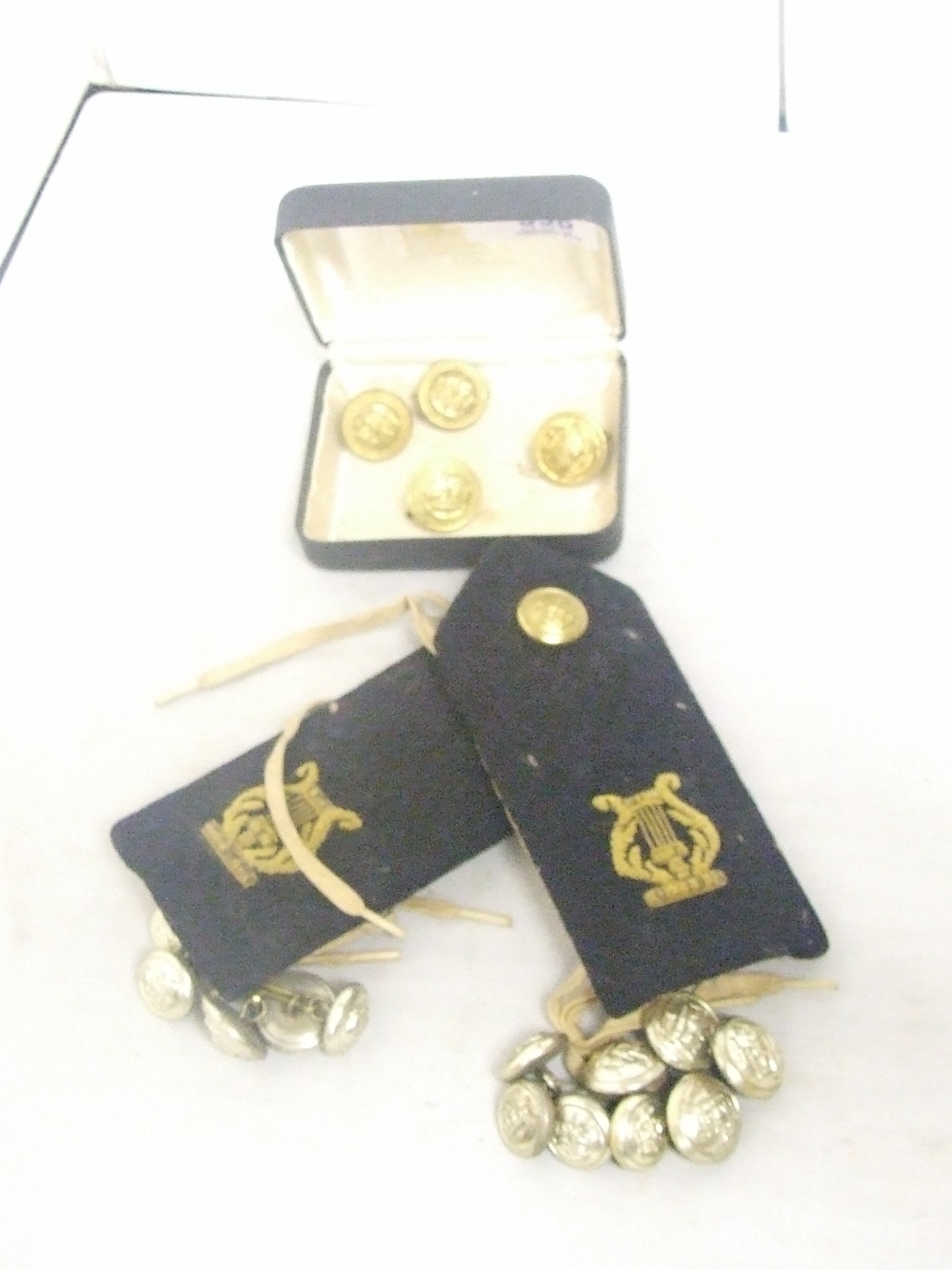 A selection of military/naval buttons and epaulettes