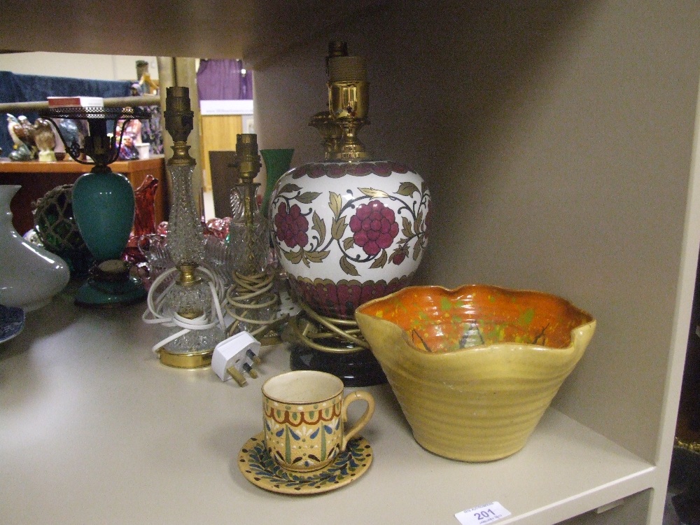 A selection of table lamps, an earthenware teacup and saucer etc