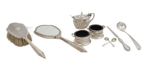 A COLLECTION OF SILVERWARE comprising a pair of circular salts, an oval mustard pot, a hair brush