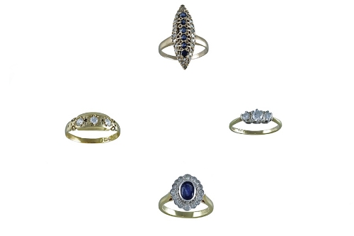 A SAPPHIRE AND DIAMOND CLUSTER RING, a diamond three-stone ring, with another diamond three-stone