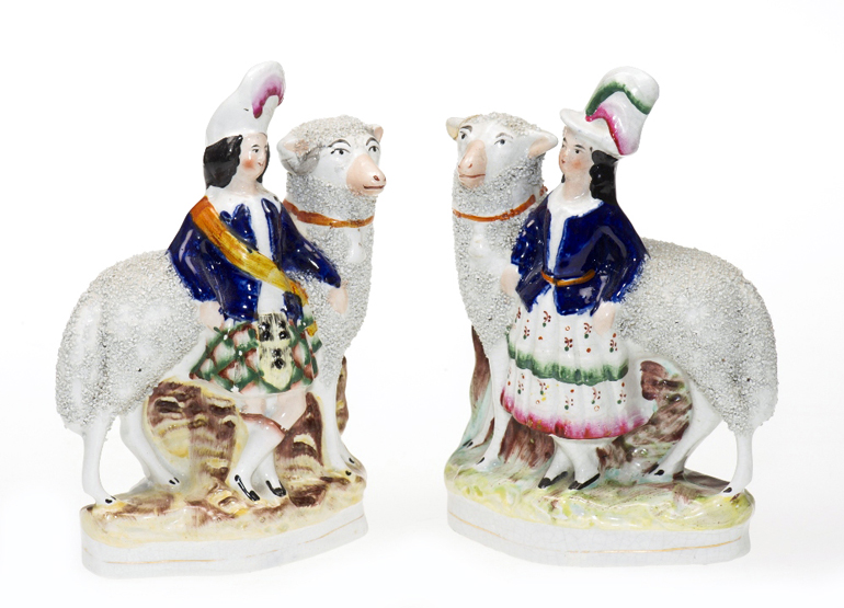 A PAIR OF LATE 19th CENTURY STAFFORDSHIRE FIGURES, in the form of a shepherd and shepherdess. Height