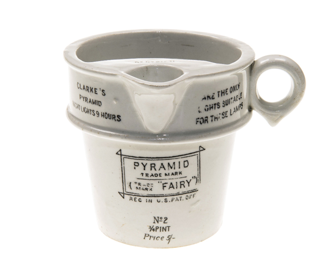 A CLARKE’S PORCELAIN LAMP RE-FILLER, the handled mug with lip and printed with a poem, “When