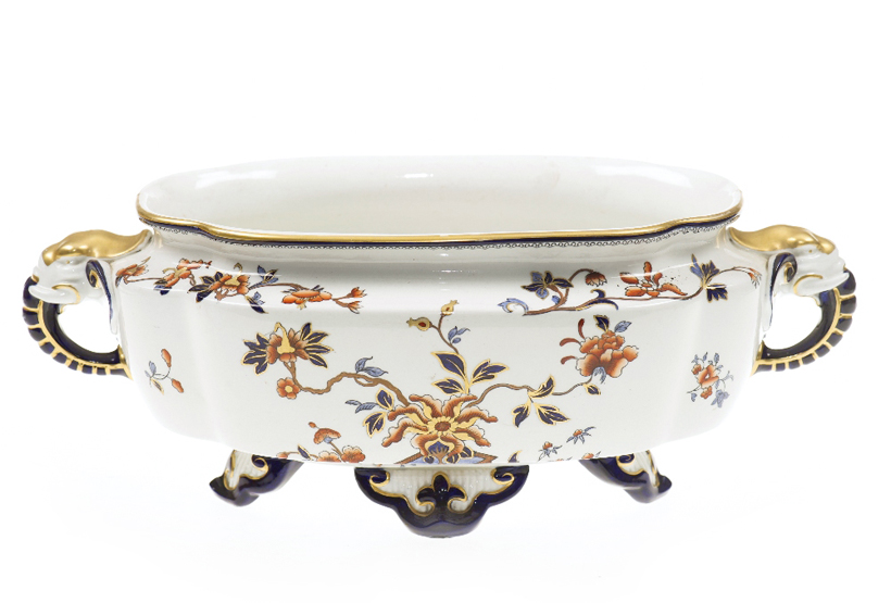 A ROYAL WORCESTER CENTREPIECE 1884, of shaped oval form, the twin handles moulded as elephants’