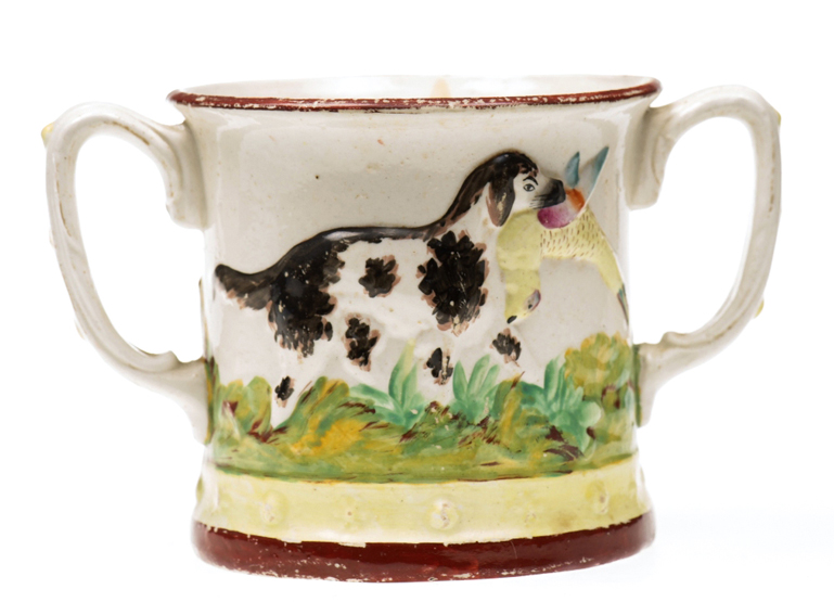 A LARGE STAFFORDSHIRE TWO HANDLED FROG MUG, moulded and painted with dogs. 13cm high