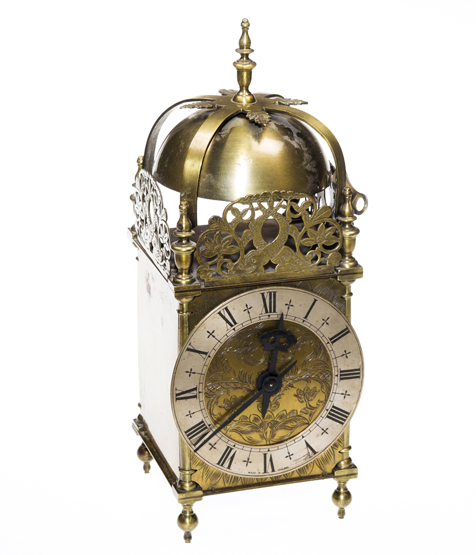 A 20th CENTURY BRASS LANTERN CLOCK, in a brass case of traditional form, with engraved brass and