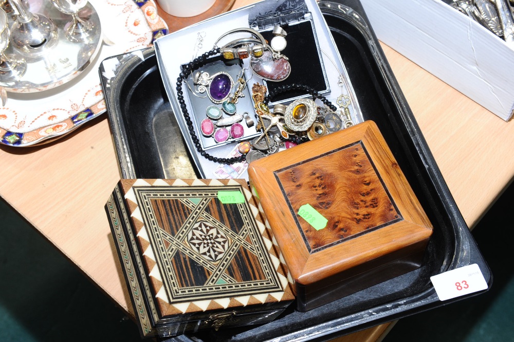 A tray of silver and modernist jewellery and two boxes