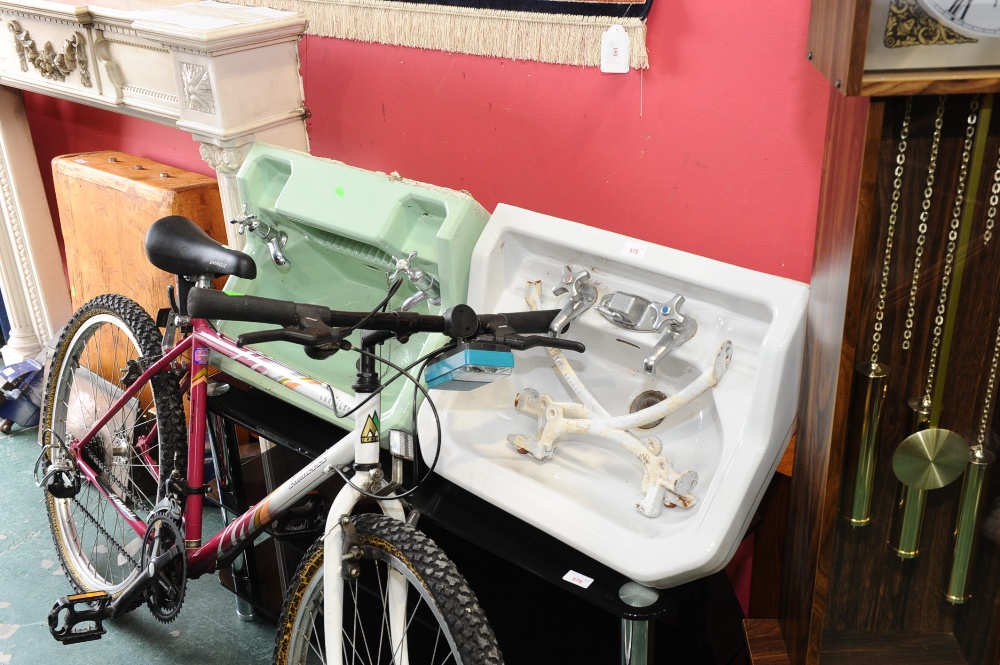 Two enamel bathroom sinks