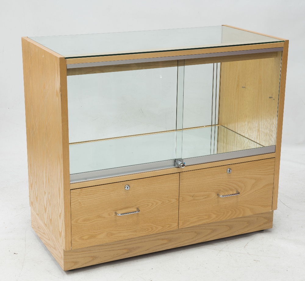 A mirrored glazed shop display cabinet