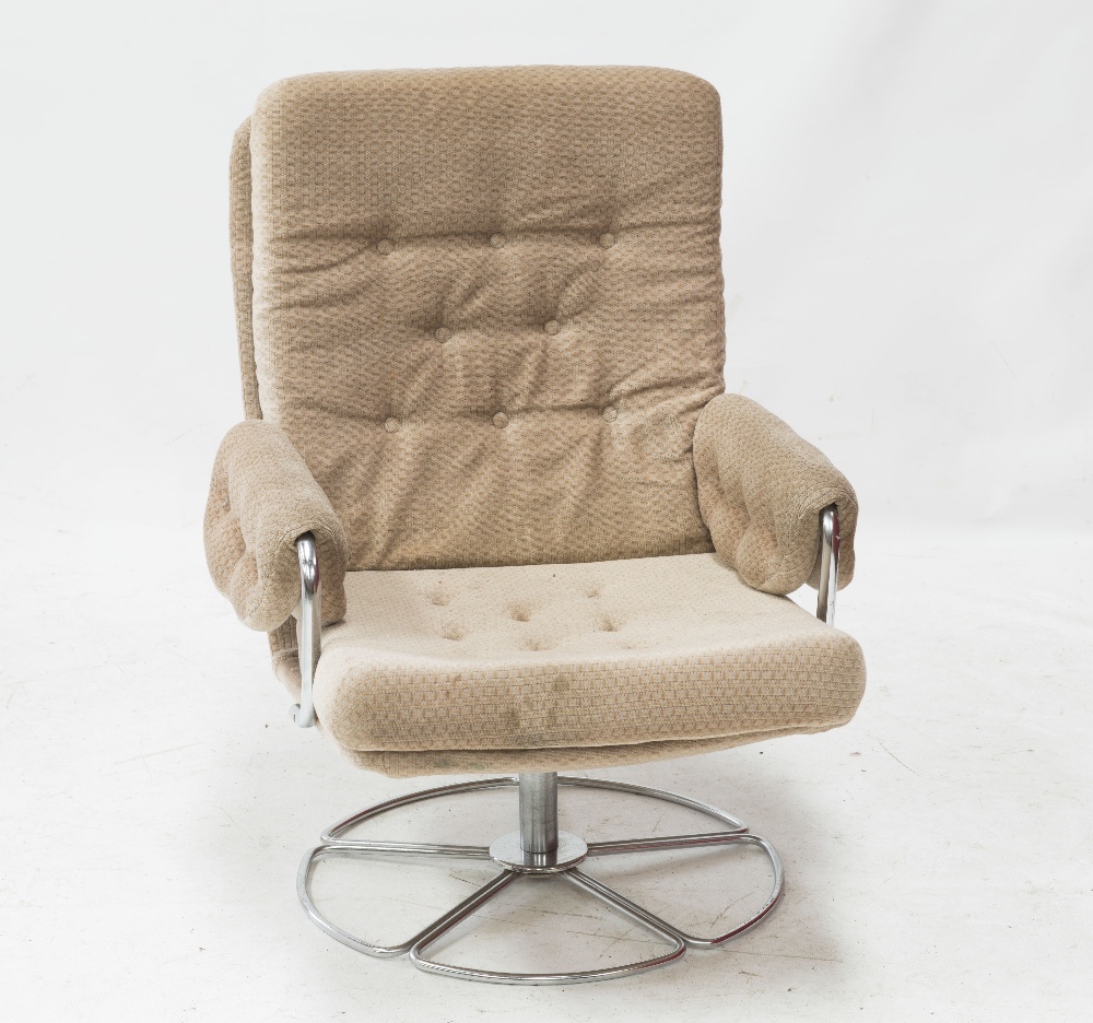 A 1970`s/80`s chrome framed swivelling armchair