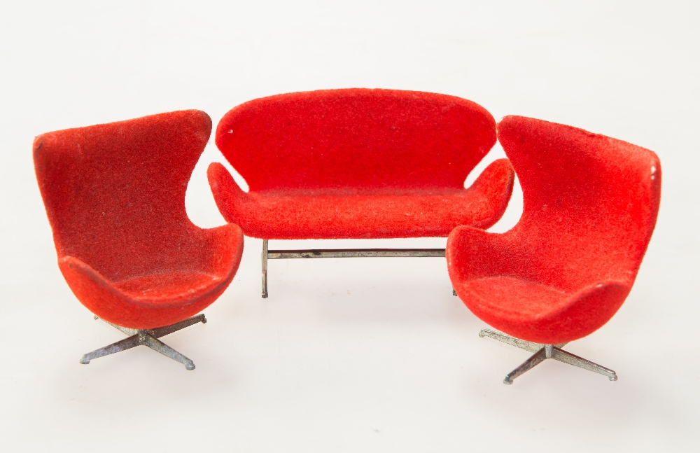 A group of miniature furniture after Arne Jacobsen comprising: a Swan sofa and a pair of Egg chairs,