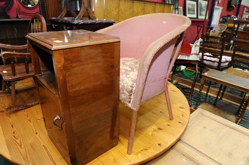 A walnut bedside cupboard, tog, with Lloyd Loom style chair
