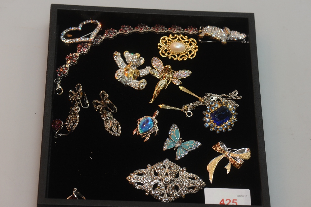 A collection of costume jewellery including three brooches from the Adrian Buckley Pave Collection