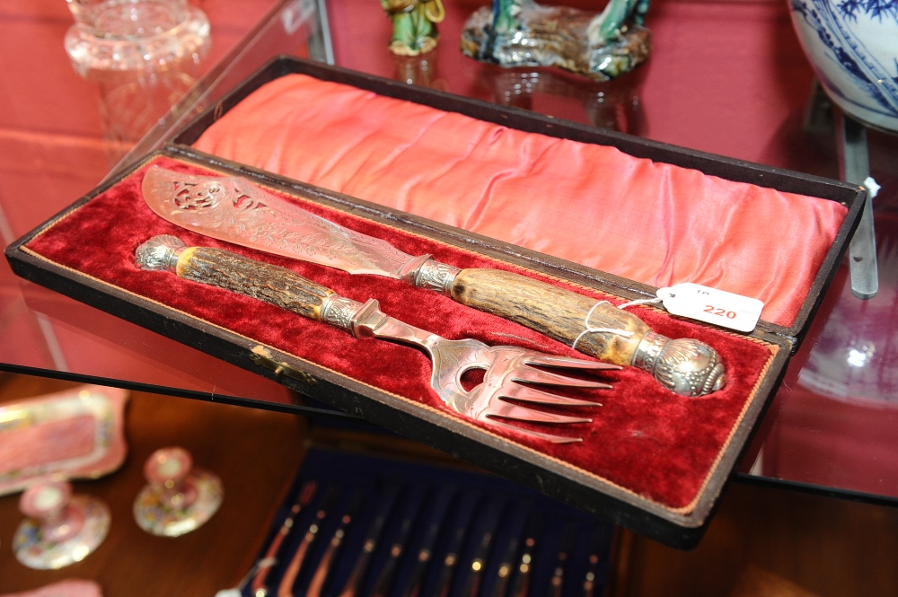 A cased set of Victorian antler-handled silver-plated fish servers.