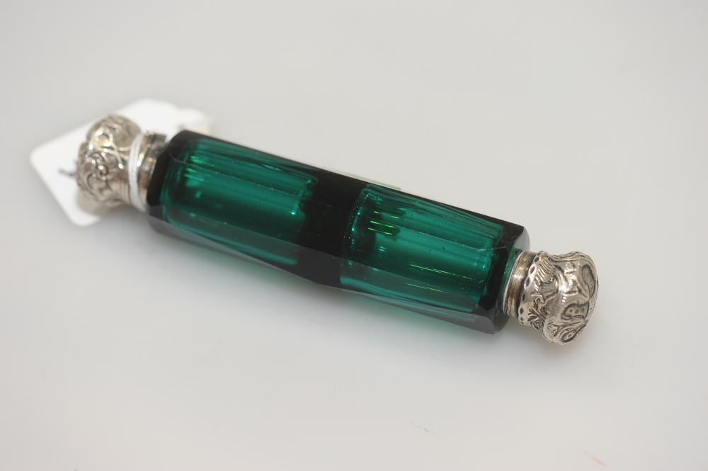 A 19th century green glass double ended scent bottle with white metal mounts