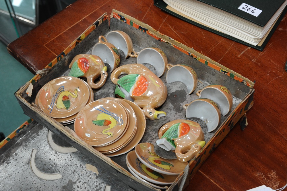 A child`s six piece porcelain duck form tea set, in original box.