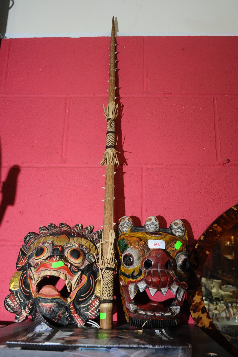 A tribal spear tog. with two Chinese dragon masks