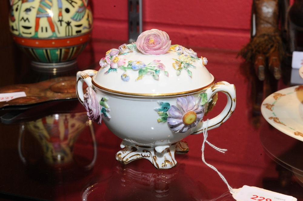 An English porcelain two-handled floral encrusted jar and cover of  Coalbrookdale type.