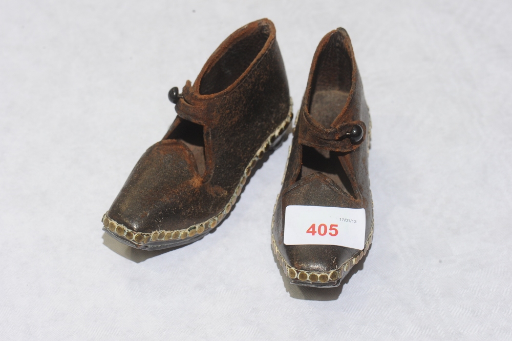 A Pair of Victorian child`s clogs, brown leather with brass stud decoration