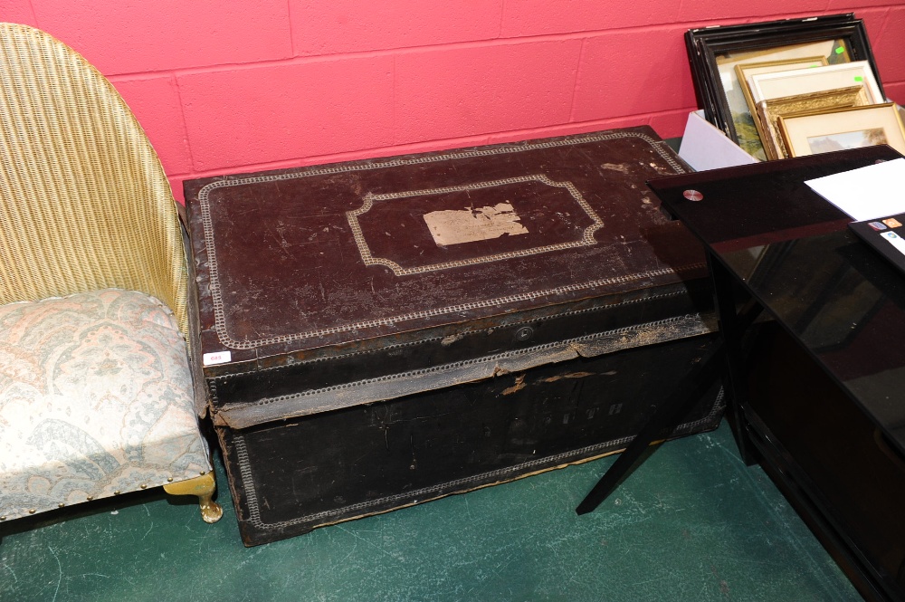 A late 19th/early 20th century camphor-lined leather trunk, of plain rectangular form, with