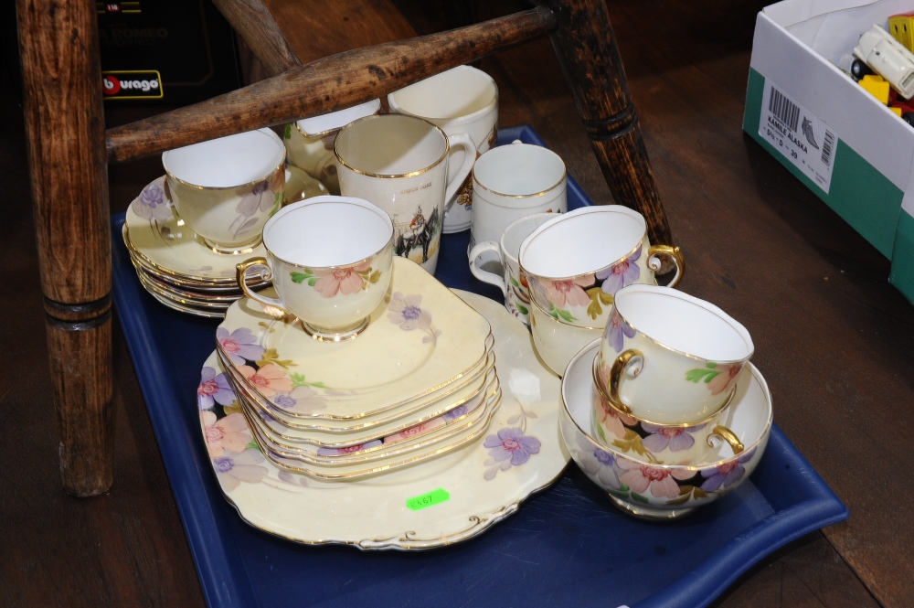 A tray inc. commemorative ware and Sunderland ware mugs and a 1930`s hand painted partial tea