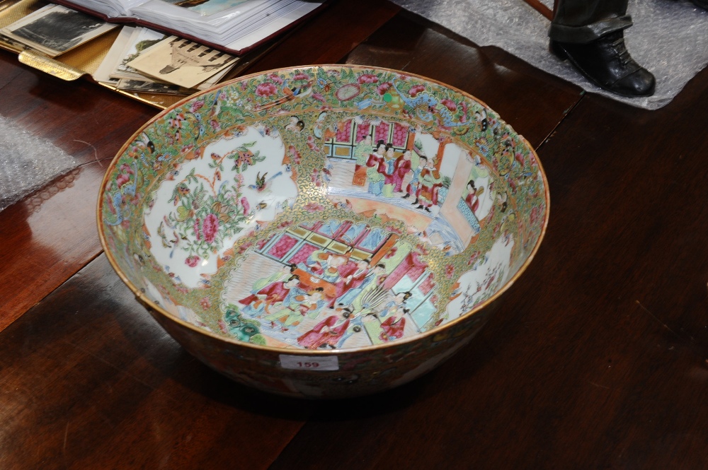 A Canton porcelain punch bowl painted with figure in a landscape, (a/f). 35cm diameter