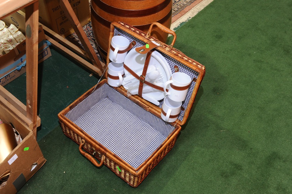 A picnic hamper with contents