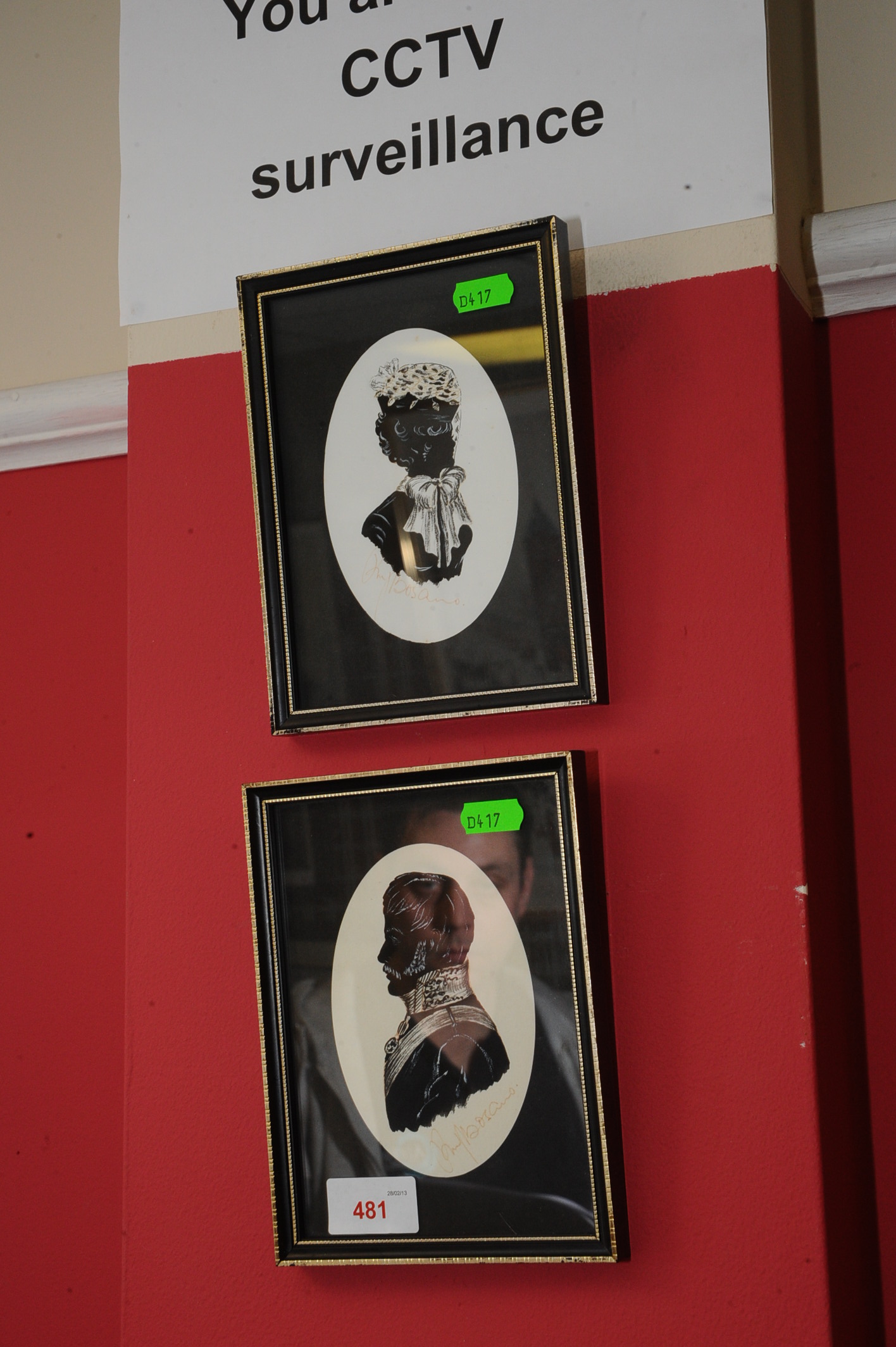 A pair of silhouettes in period style, each signed