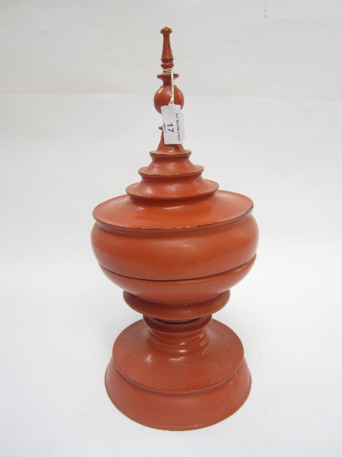 A BURMESE RED LACQUER COVERED STAND, with inner liner, with minaret finial and ribbed body on a