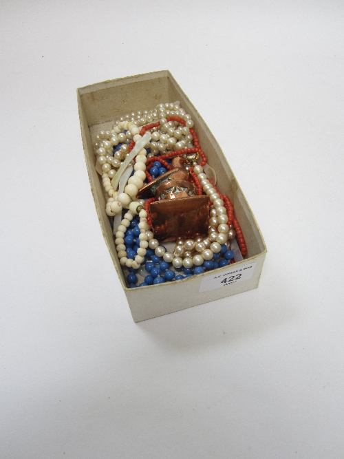 A CORAL BEAD NECKLACE, an ivory bead necklace, other bead necklaces, a copper model of a bird on a