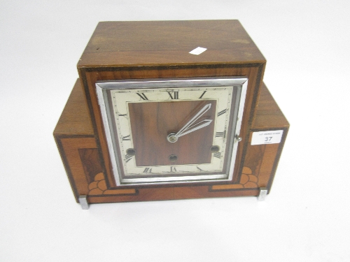 AN ART DECO STYLE WALNUT CASED MANTEL CLOCK, inlaid decoration, silvered chapter ring, movement