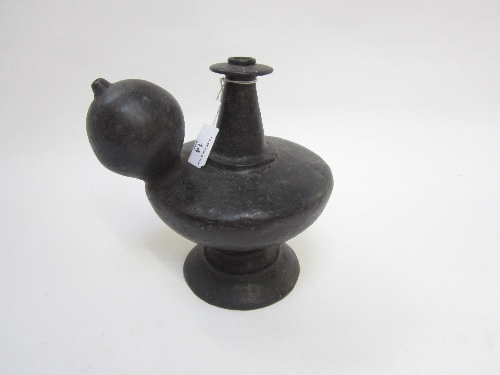 A THAI BLACK GLAZED KENDI, of squat ovoid form with bulbous spout, 22.5cm.