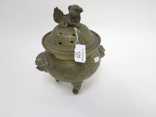 A CHINESE BRASS KORO, circular form, pierced domed lid with a temple dog finial, 26cm.