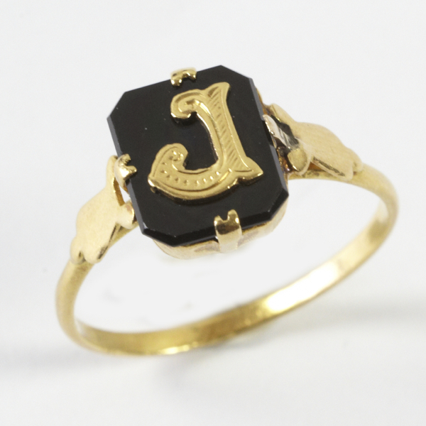 Ladies` antique initial ring, comprising hexagonal black onyx with a gold initial `J` in the centre,
