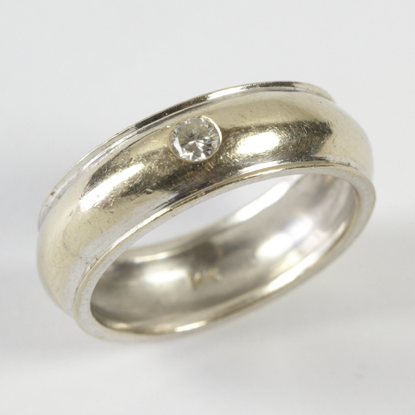 Gent`s diamond set band, approx. 8mm wide, `D` shaped with edge lip, inset with a brilliant cut