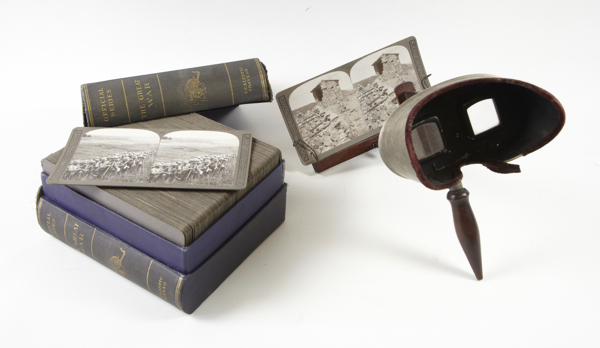 Antique stereoscope by `Underwood & Underwood, New York`, complete with two sets of boxed slides