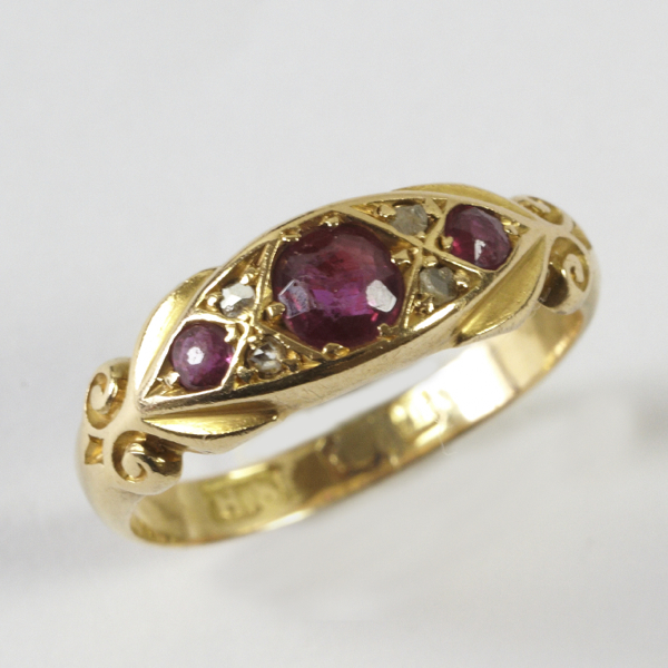 Ladies` antique ring, comprising three rubies with two small rose cut diamonds set between each,