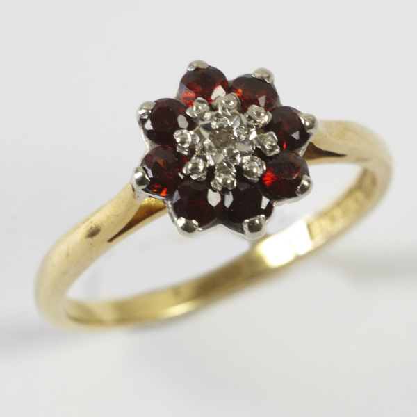 Ladies` cluster ring, comprising very small illusion set diamond to centre, surround of eight