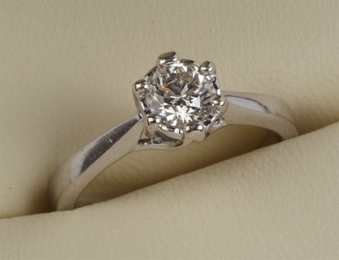 Ladies` diamond solitaire ring by `Goldsmiths`, comprising brilliant cut stone, 0.50 carats, in a