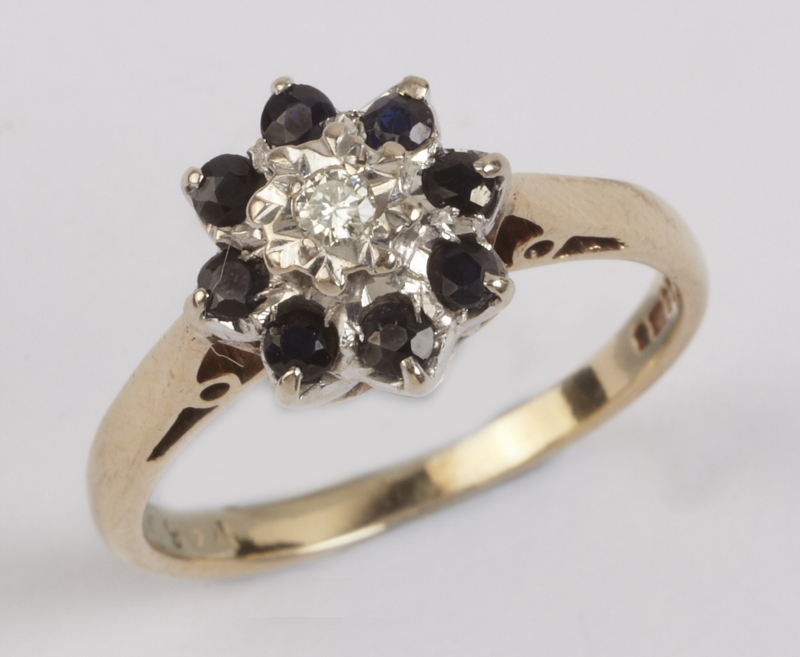 Ladies` cluster ring, comprising small brilliant cut diamond in illusion setting to centre, surround