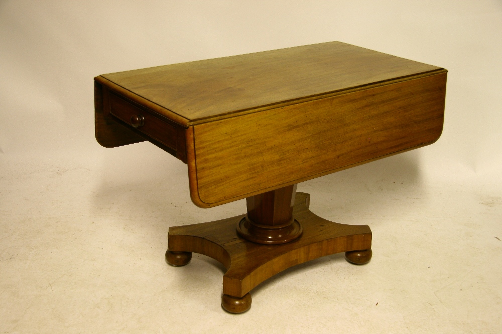 An early Victorian mahogany drop-leaf supper table with rectangular top, fitted end drawer, on