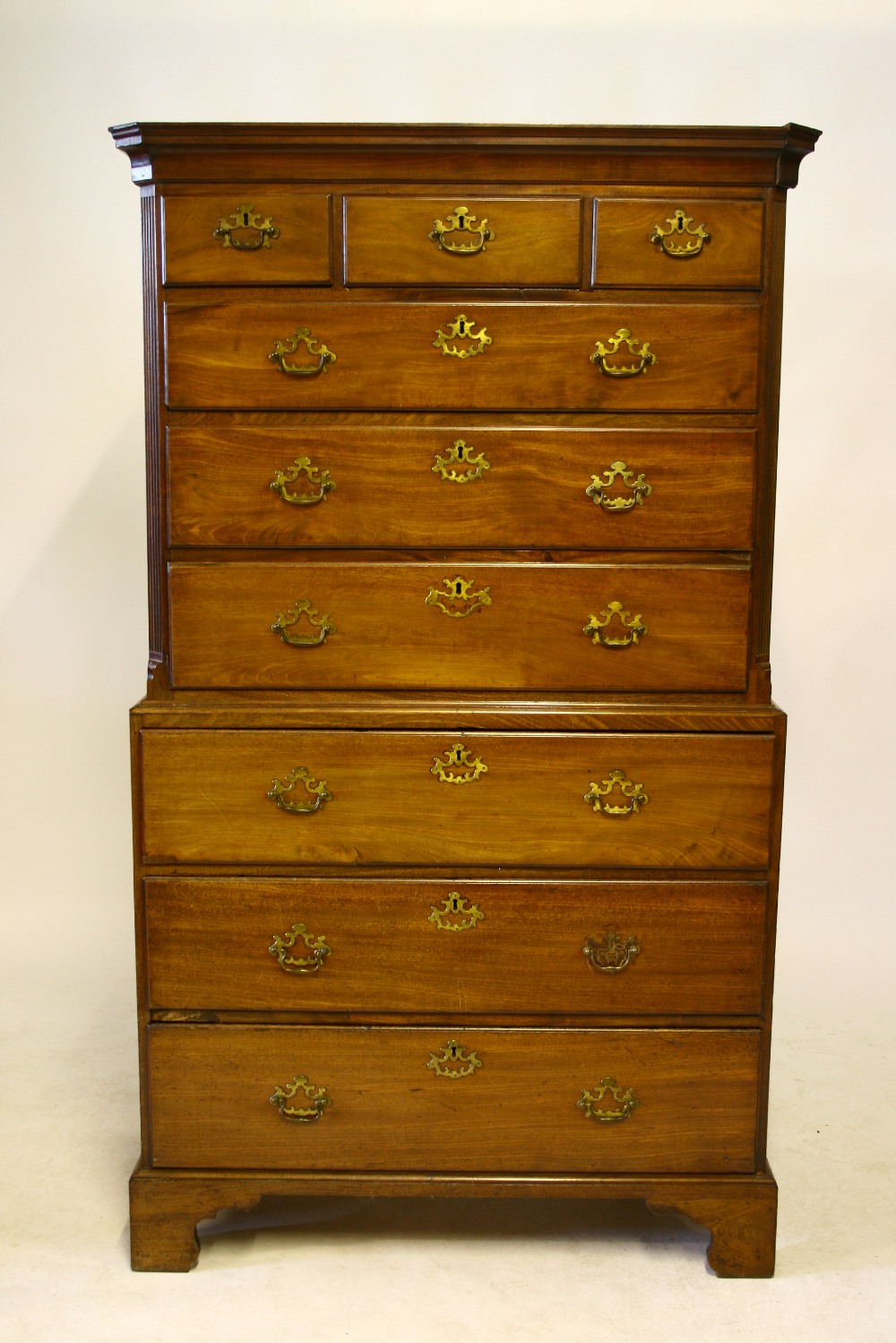 AN 18th century MAHOGANY CHEST-ON-CHEST, the upper part with moulded cornice & reeded canted