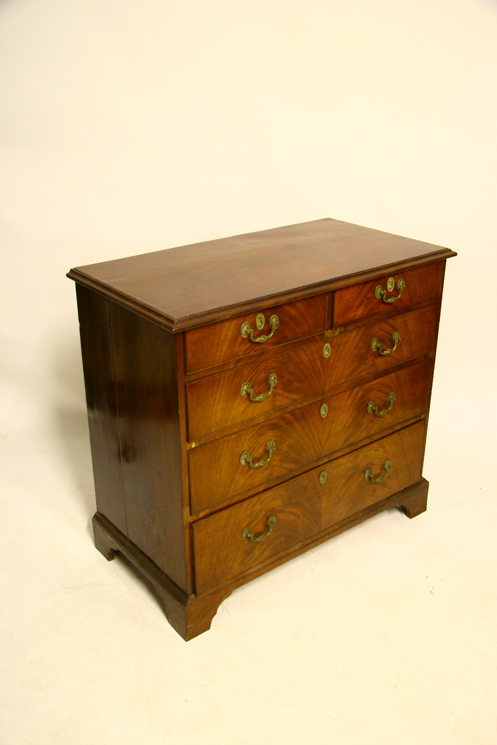 A late 18th century mahogany chest fitted two short & three long graduated drawers with cast brass