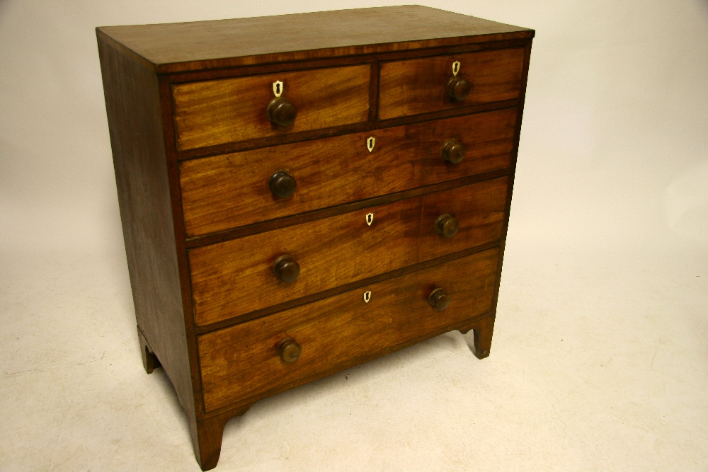 An early 19th century mahogany chest fitted two short & three long graduated drawers with inlaid