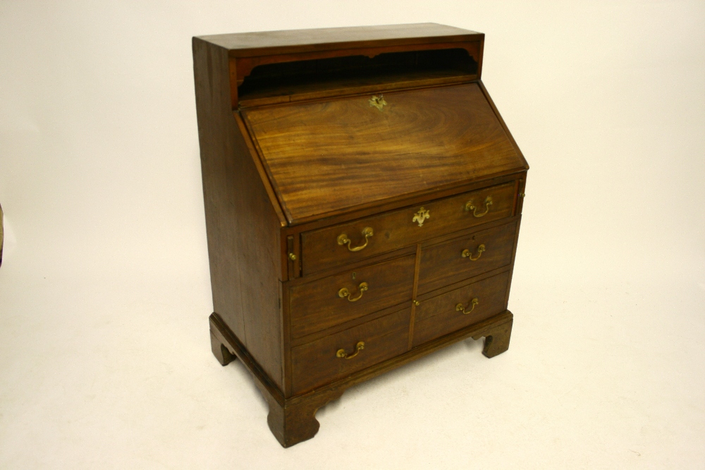 An 18th century style mahogany fall-front bureau with open compartment above, fitted frieze drawer