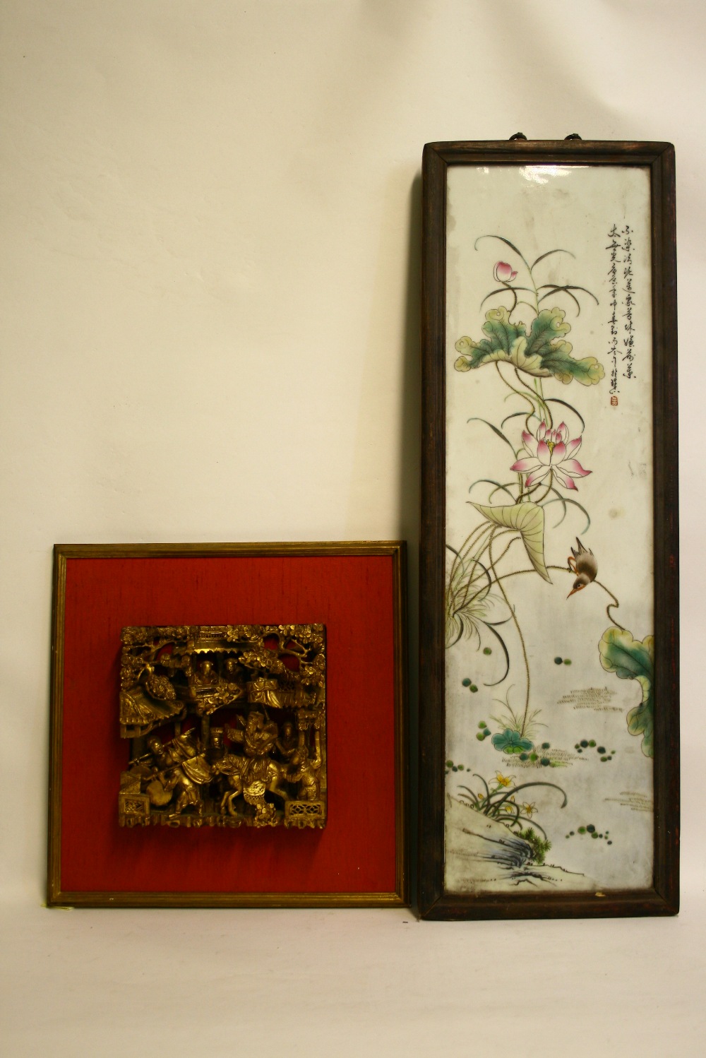 A Chinese porcelain narrow rectangular plaque painted with a songbird amongst lotus flowers,